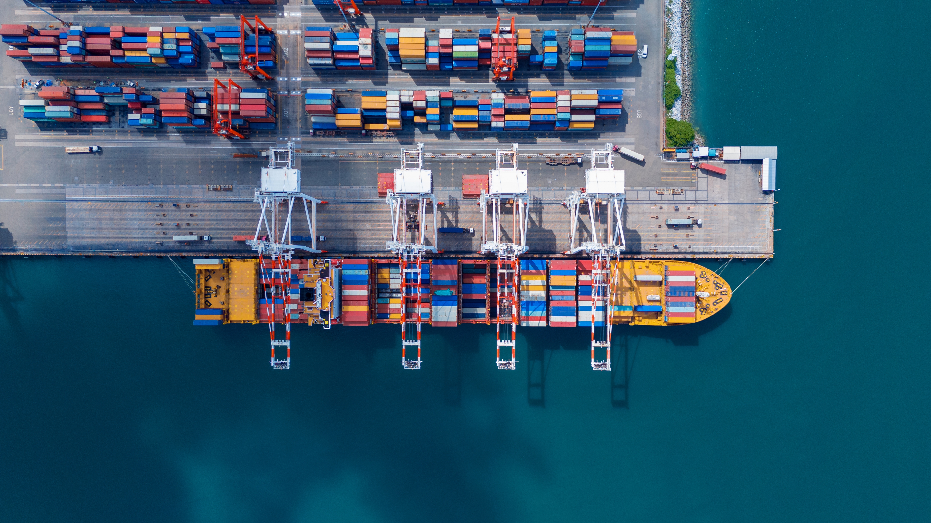 Aerial view of a cargo ship at a container terminal